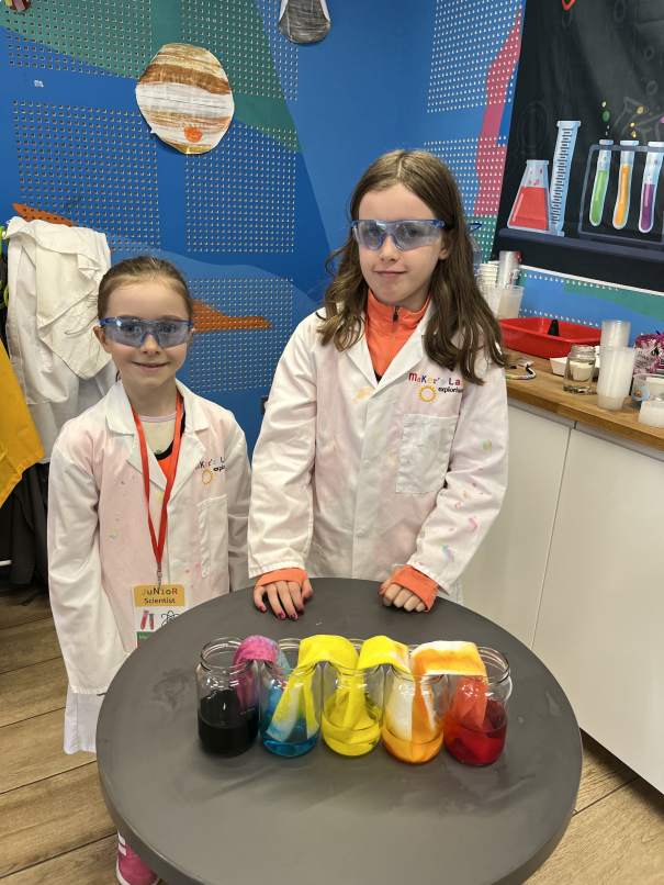 Young campers engaged in hands-on science experiment during Make and Do time at Junior Science Summer Camp